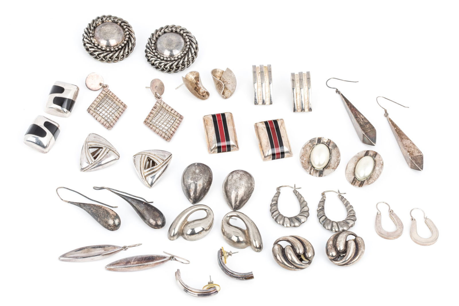 SILVER STATEMENT EARRING GROUPING 260.3g: 7 matched pairs of clip-on earrings ranging from 25.9mm long to 39.4mm long. 180.9 grams 5 matched pairs of studs (no backs) ranging from24.5mm long to 59mm long. 45.6 grams 3 matched pairs of drops r