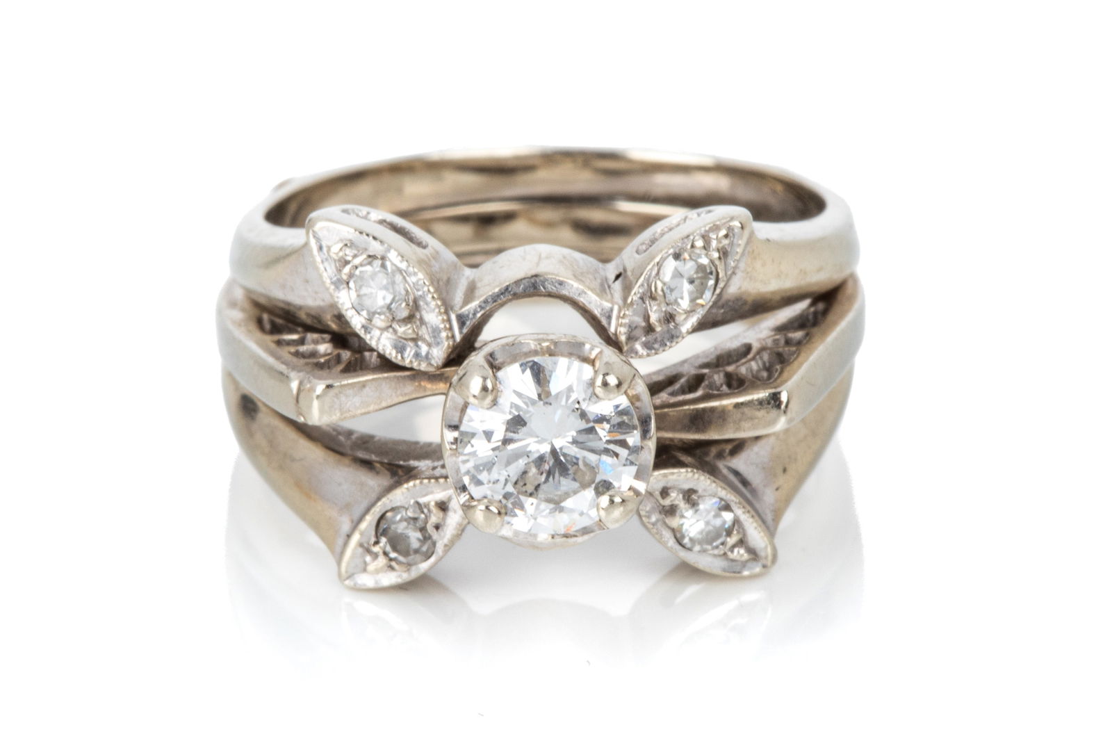 14K WHITE GOLD DIAMOND WEDDING SET, SOLDERED 6.9g: 14K white gold diamond engagement ring and jacket, soldered together, measuring 11.2mm wide by 8.6mm tall. Featuring round brilliant cut diamond weighingapproximately 0.55ct of SI2-GH quality.