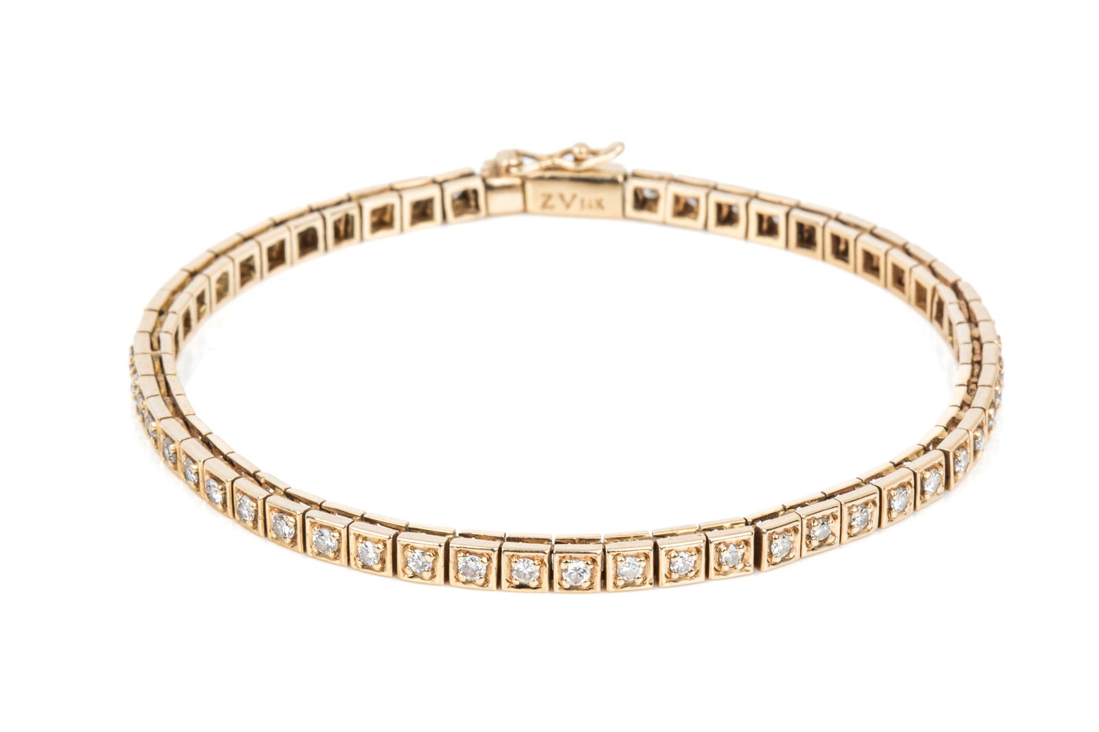 14K GOLD 1.08cttw DIAMOND TENNIS BRACELET 11.2g: Measuring 6.75 inches long by 3.1mm wide, equipped with hidden box catch and side safety. Featuring 54 round brilliant cut diamonds of SI-GHI quality, estimated total diamond weight 1.08cttw. 11.2 gra