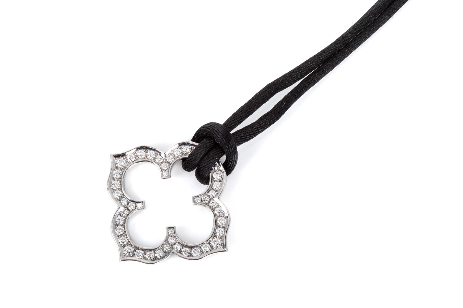 CARTIER HINDU DIAMOND NECKLACE 18K & SILK 8.6g: Swiss made 18K white gold Cartier Hindu Diamond Necklace measuring 29.4mm wide by 2.2mm thick, numbered CA9035 stamped with the St. Bernard 18K hallmark, copyright, and Cartier stamps. Featuring 44 gr