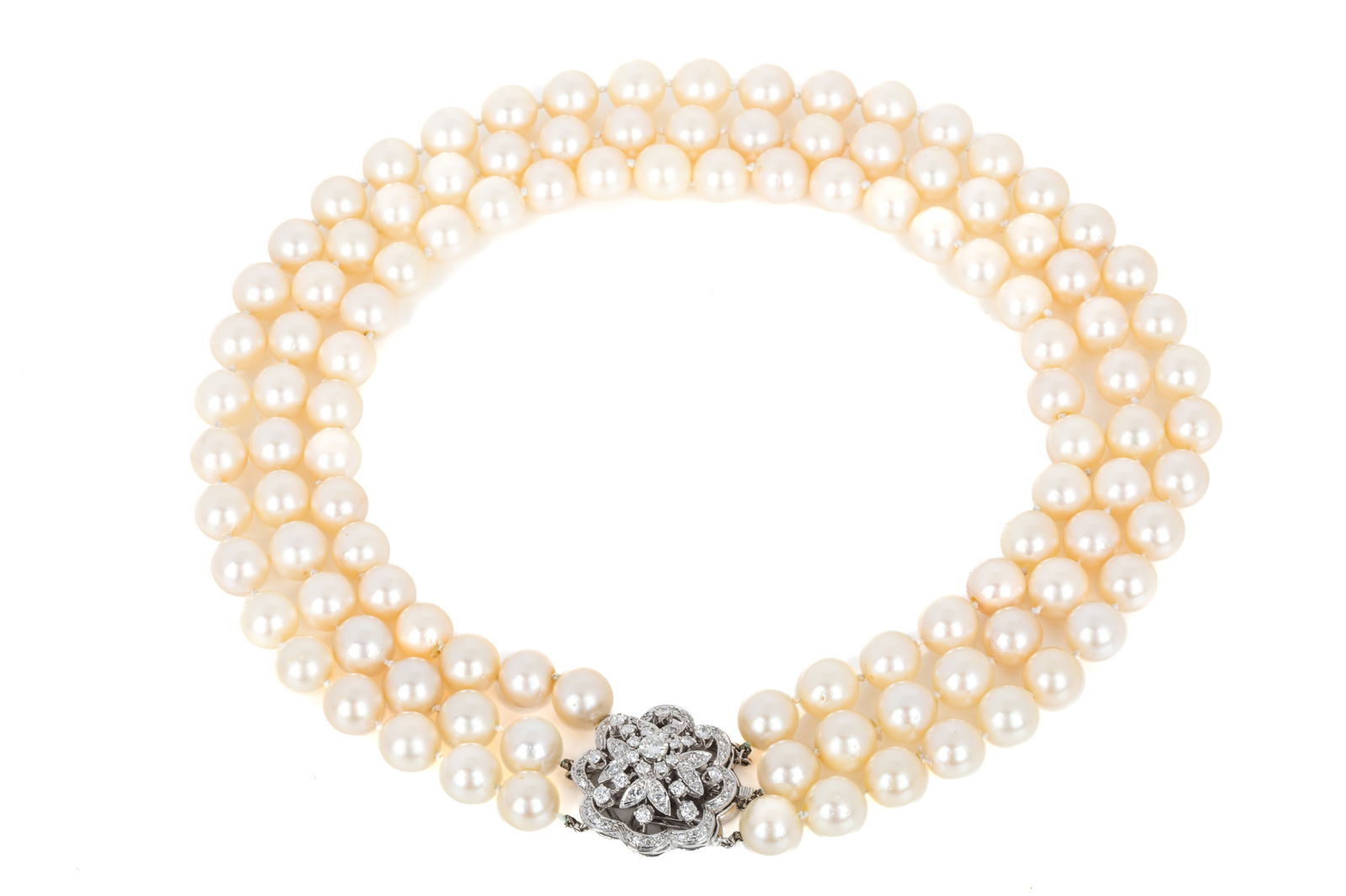 AKOYA TRIPLE-STRAND w 1.47cttw DIAMOND CLASP, 14K: Triple-strand 16 inch pearl necklace featuring 111 round Akoya pearls measuring between 9.5 to 10mm of medium light orangey red (cream) body colour, pink overtones, good matching, good luster, lightly