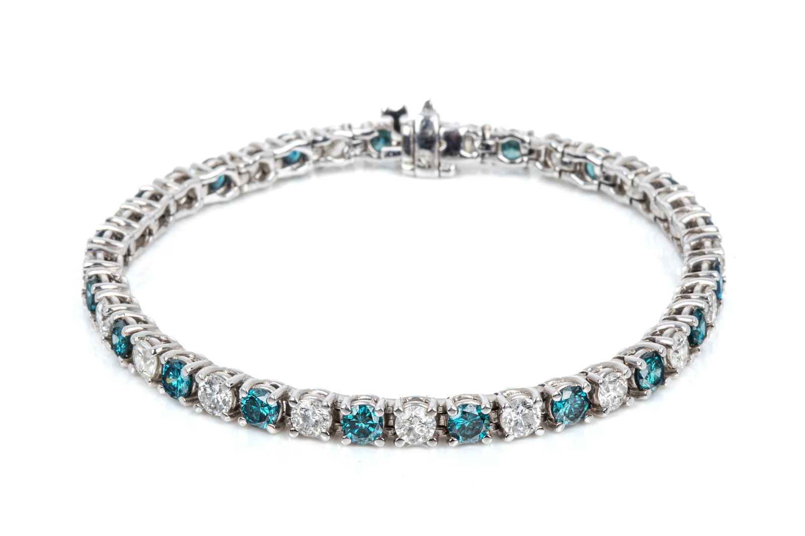 14K 7.48cttw DIAMOND TENNIS BRACELET 14.2g: 14K white gold like-new diamond tennis bracelet measuring 7 inches wearable length by 4.2mm wide, equipped with side-button plunger clasp and hinged hidden safety lock. Featuring 39 round brilliant cu