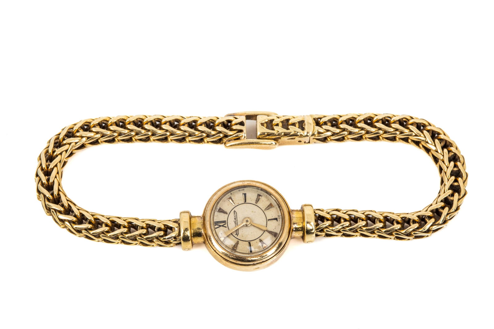 18K JAEGER-LECOULTRE COCKTAIL WATCH 29g: Vintage Swiss made 18K yellow gold Jaeger-LeCoultre cocktail watch, round case measures 16.5mm, features plastic crystal, hidden manual crown, gold tone dial with gold hands and applied and painted ma