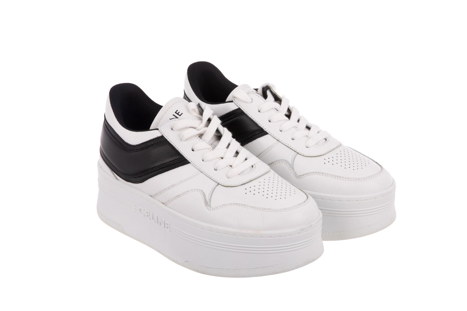 CELINE BLOCK CALFSKIN SNEAKERS BLACK AND WHITE: Size 37. Style code RM 0222. Brand new never worn, with slight staining to the heal. Does not include original box. comp: https://poshmark.ca/listing/Celine-Block-Platform-