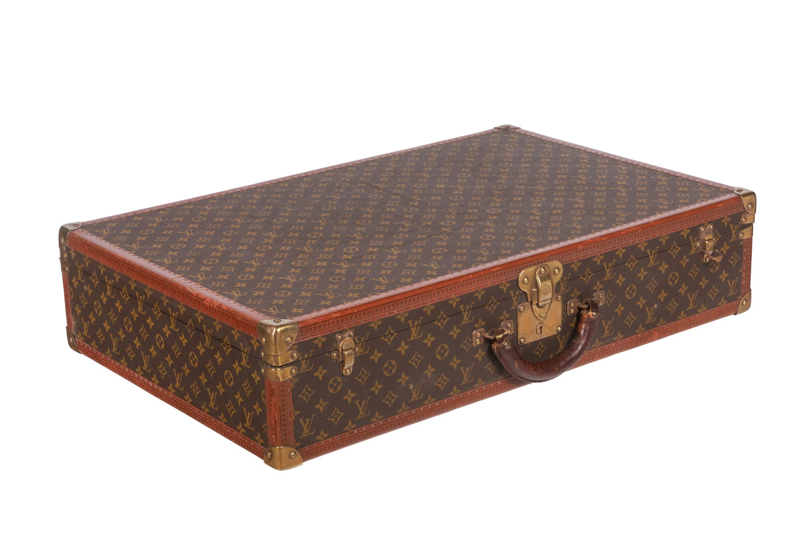 VINTAGE LOUIS VUITTON MONOGRAM HARDCASE SUITCASE: Louis Vuitton Monogram Canvas Hard-sided Suitcase, 1950s. Does not include original keys. Serial number on Ave Marceau 78 Bis Paris label. L. 31 1/2in x W. 20 3/8in x D. 6 3/4in (80cm x 52cm x