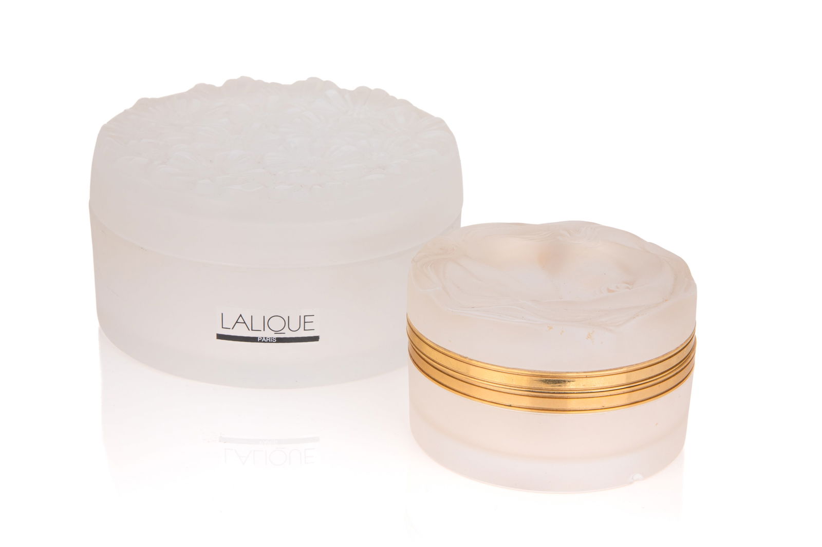 TWO LALIQUE FRANCE GLASS DRESSER BOXES: Frosted glass with flowers and nude. Nude with metal mounts (small chip). Dia of larger 11.5cm (4 1/2in)