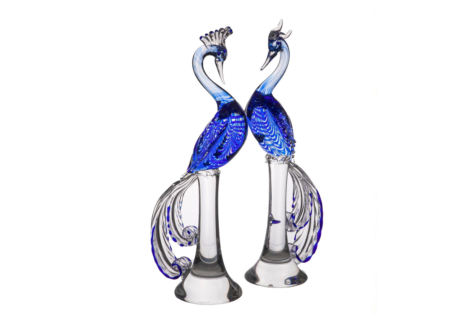 PAIR OF ITALIAN GLASS BIRDS BY CENEDESE: Blue to clear glass bodies of the peacocks with a textured pattern, long tail, perched on long stands, signed to base. H 23" x W 9"