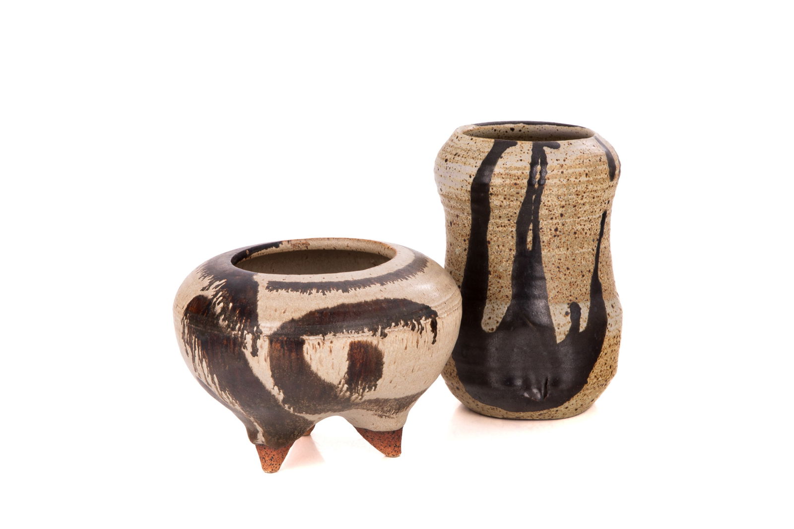 DANIEL RHODES (American 1911-1989): Two Stoneware vessels with mottled glaze. H. 6 1/2" x Dia. 4" H. 4 1/4" x Dia. 6"