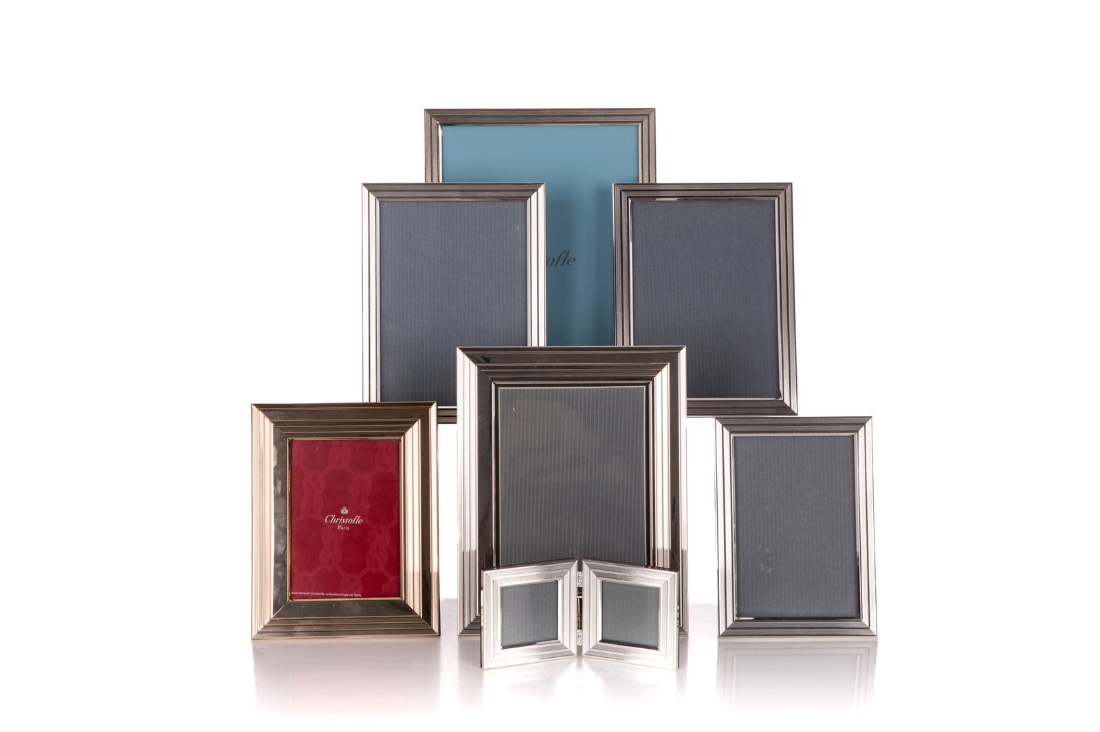 EIGHT CHRISTOFLE FRENCH SILVERPLATED PICTUR FRAMES: Largest H. 10 5/8" x W. 8 1/4" Smallest H. 7 5/8" x W. 6" Diptych H. 3 1/8" x W. 3 1/8"