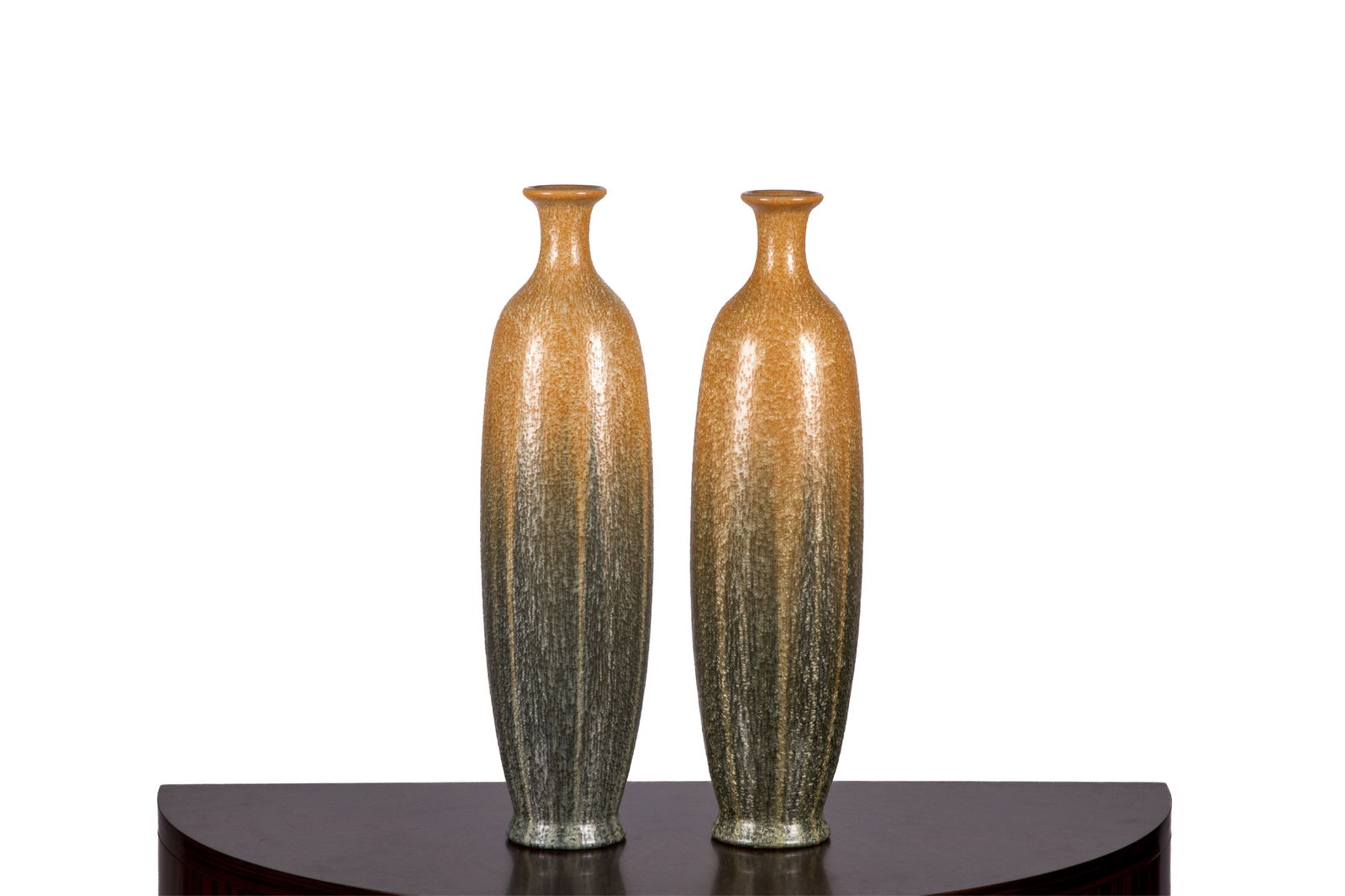 PAIR ART NOUVEAU FLAMBE SALT GLAZE POTTERY VASES: Large pair of Art Nouveau flambe pottery vases in mottled green and ochre glaze by Hosley TM Potteries. Signed 'Hosley TM Potteries' to the underside. American, circa 1930s. H.: 56 cm (22 in.)