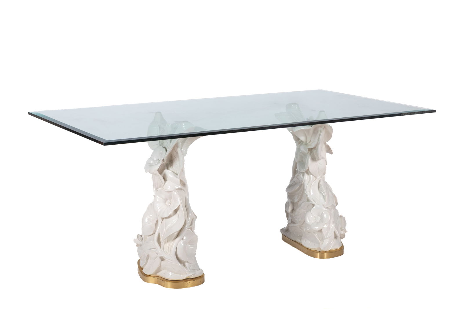 VINTAGE GLASS TOP TABLE: Rectangular glass top resting on two white glazed floral pottery bases, probably Italian. H 31" x W 72" x D 40"
