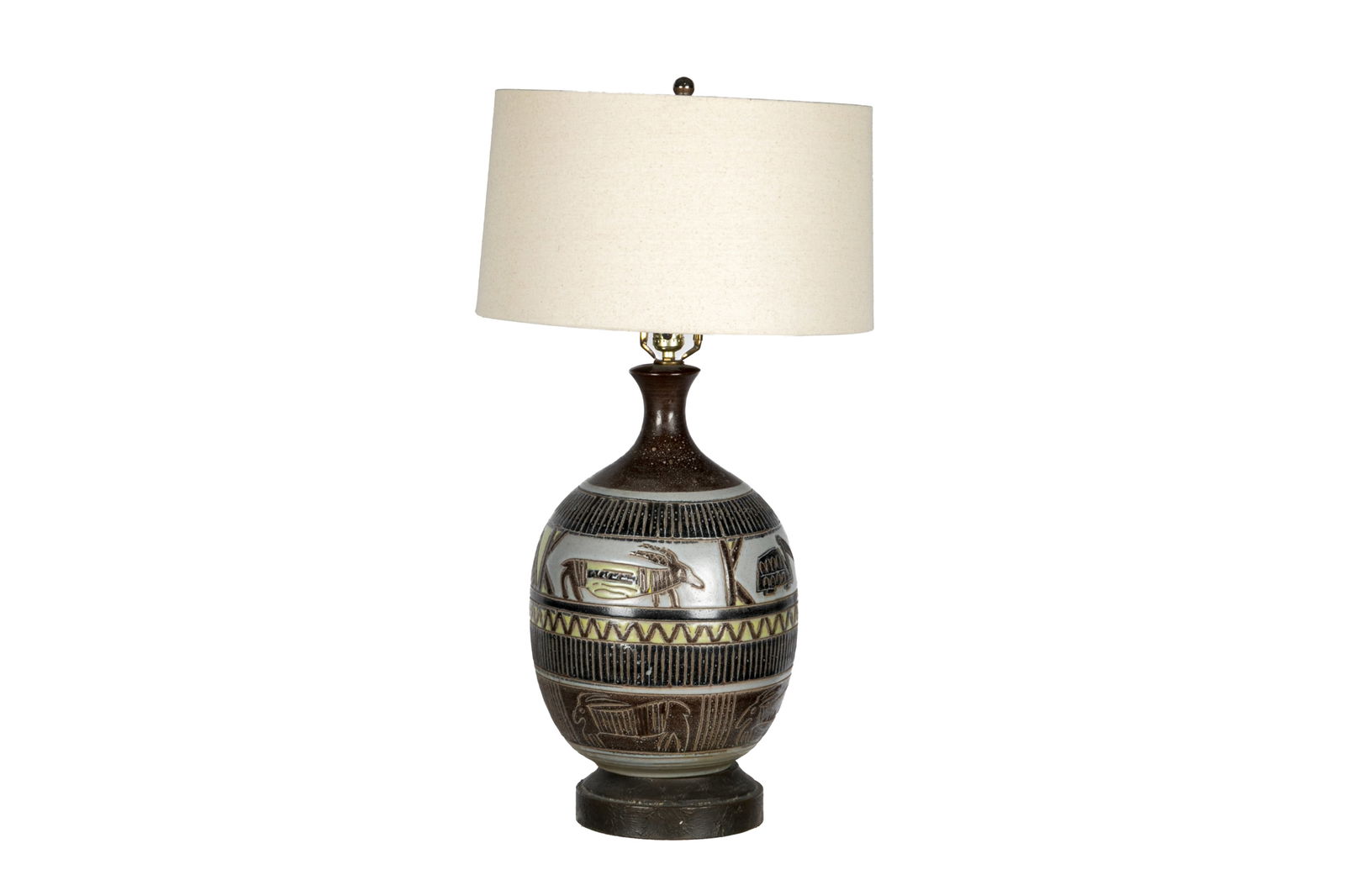 VINTAGE POTTERY TABLE LAMP: Mid Century in mat glaze with incised African animals. H of the vase: 20", Overall H: 32"