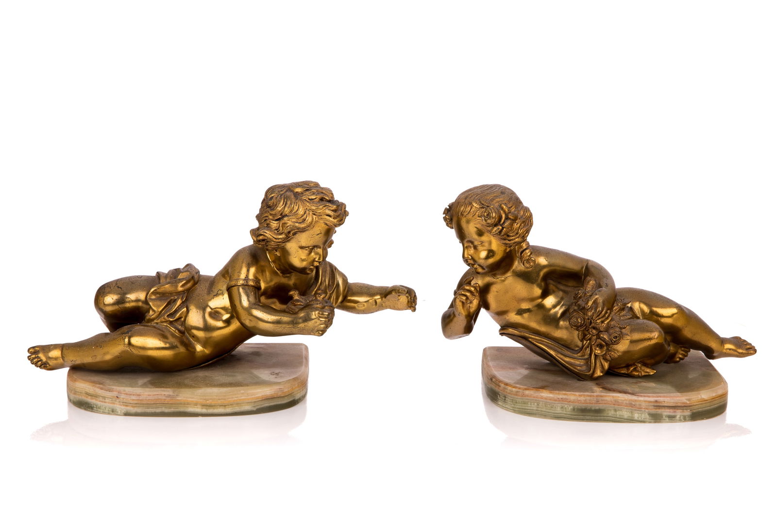 PAIR OF GILT BRONZE PUTTI SCULPTURE: Reclining figures on green onyx bases, early 20th C. H. 6 1/2" x L. 10" (16.5cm x 25.5cm)
