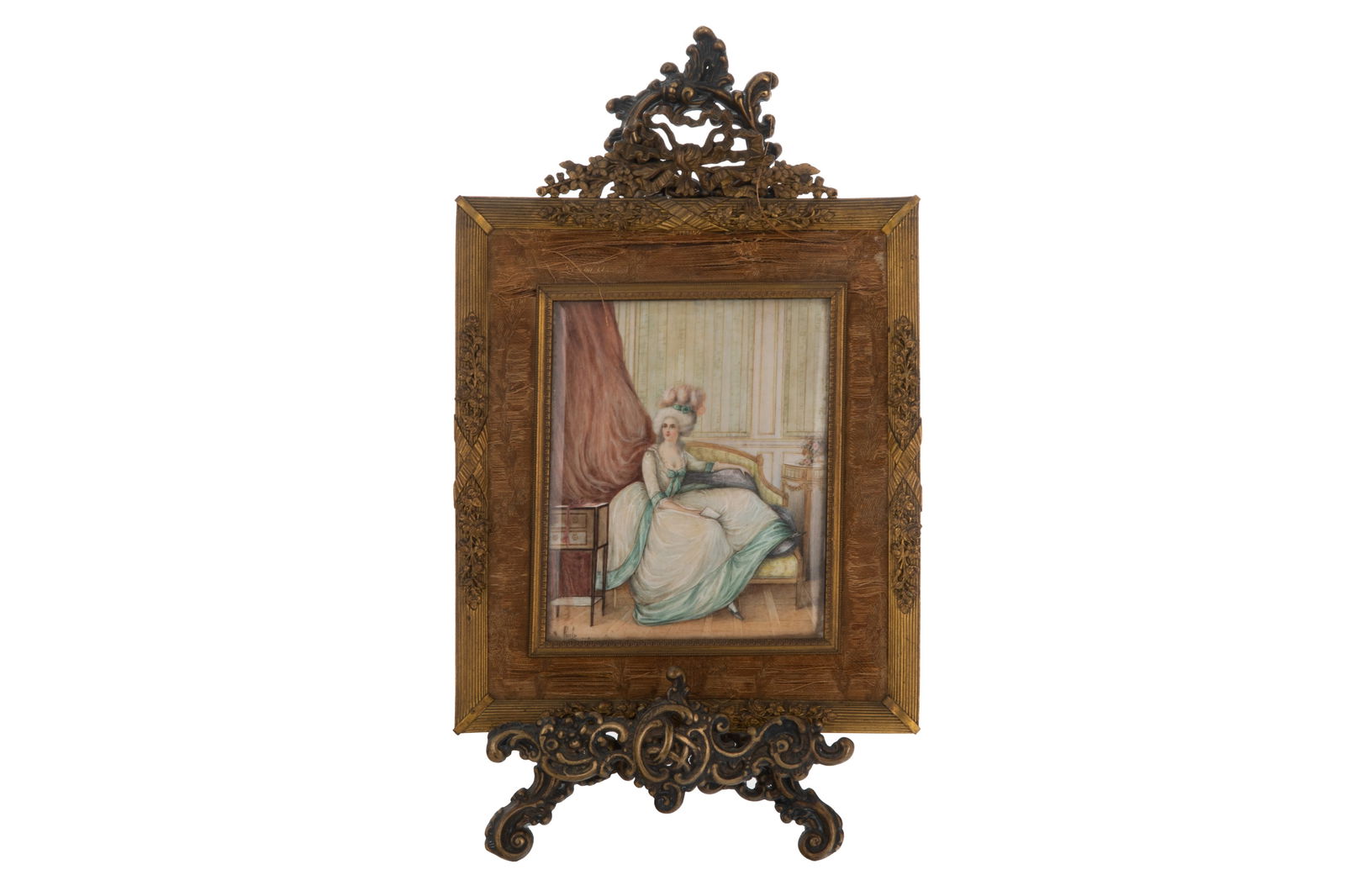 HAND PAINTED PORTRAIT MINIATURE: Of a traditional French woman seated in her boudoir Signed Presley Probably French, late 19th C. In gilt metal frame with fabric (some wear)