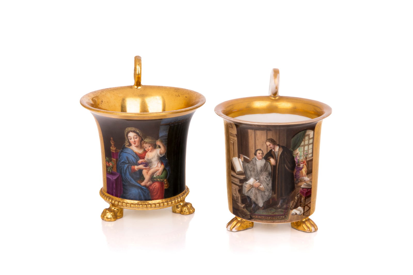 TWO FRENCH EMPIRE PORCELAIN HAND PAINTED MUGS: Oversized breakfast coffee cans raised on claw feet with hand painted religious and scholar scenes, French, 19th C. H. 4" x Dia. 4 1/4" (10.2cm x 10.8cm)