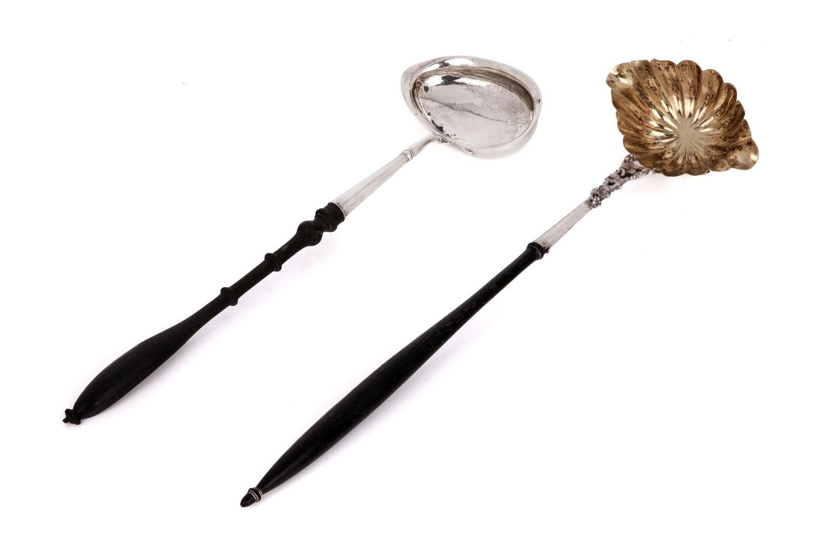 TWO ANTIQUE SILVER PUNCH / TODDY LADLES: With turned wooden handles, nineteenth century. L. 48 cm 19 in.