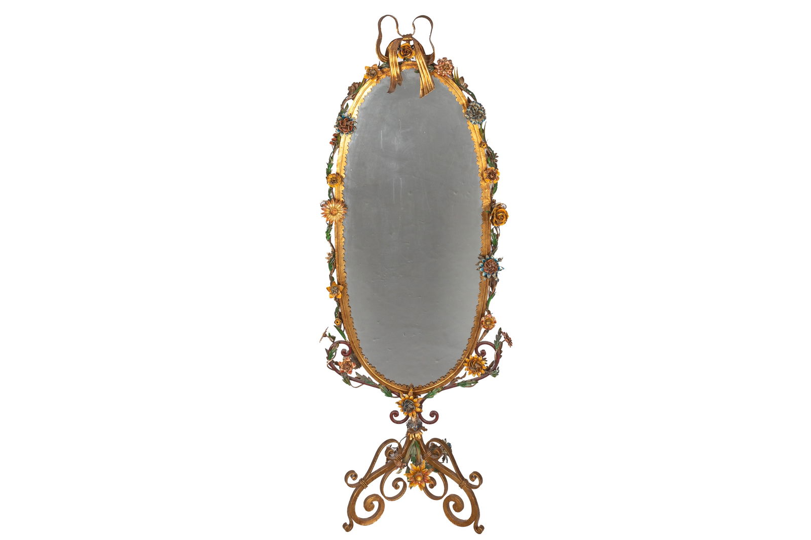 ITALIAN TOLEWARE GILT BOUDOIR DRESSING MIRROR: Featuring painted floral accents along border of mirror with a gilded bow at the crest. Standing on a tripod, the mirror is double sided and can swivel. H. 70 1/2" x W. 24 3/4" x D. 18 1/2" (at