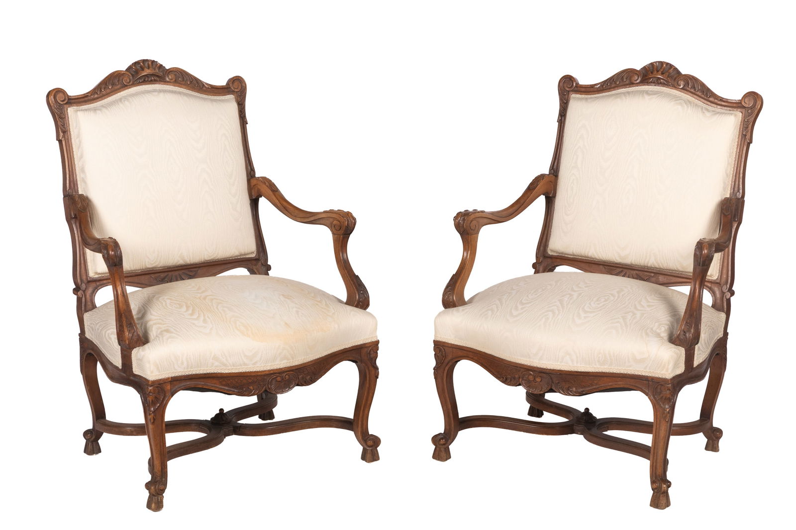 PAIR OF FRENCH PROVINCIAL ARMCHAIRS: Carved walnut frames with hoof feet and x-design stretcher, modern silk brocade upholstery. H 40" x W 28" x D 22"