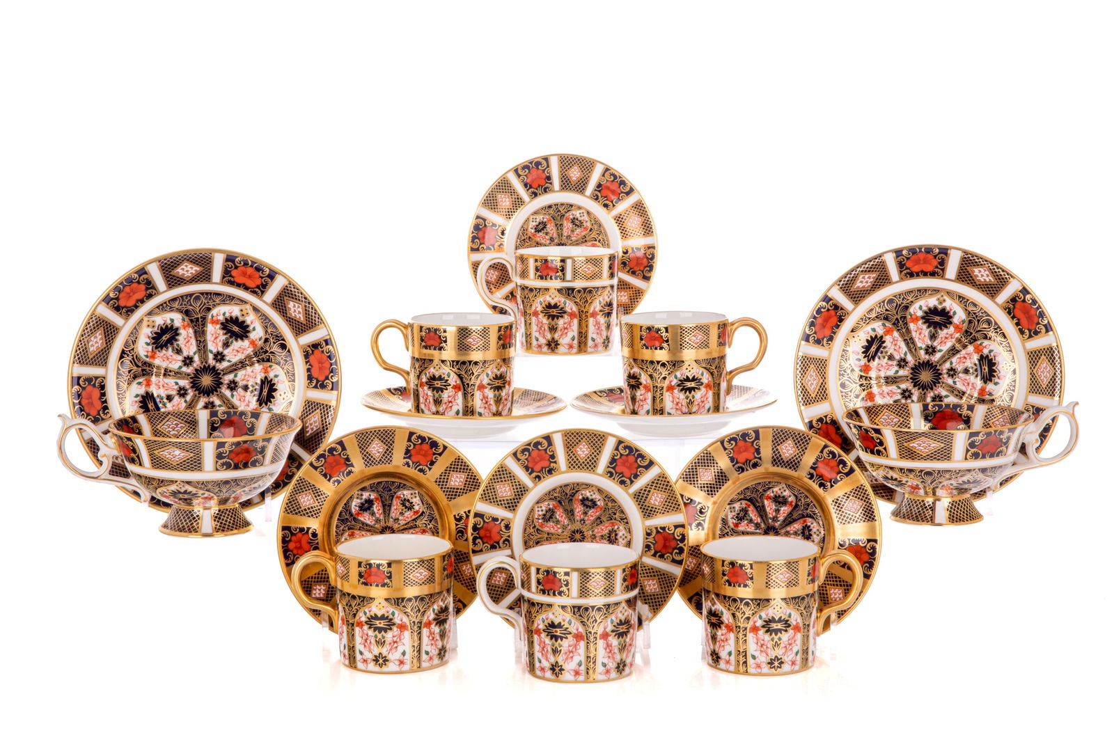 EIGHT ROYAL CROWN DERBY IMARI CUPS & SAUCERS: RCD pattern 1128 including six demi tasse cups & saucers (four with extra gold) and two tea cups & saucers with interior decoration, date codes XLI, XLIV.