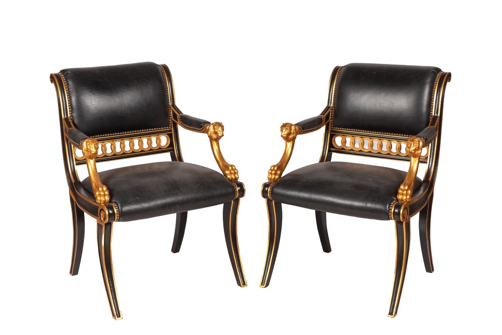 PAIR OF LEATHER UPHOLSTERED EMPIRE STYLE CHAIRS: Thar gilded arms accented with lion heads and paws, 20th C. H 35" x W 25" x D 20"
