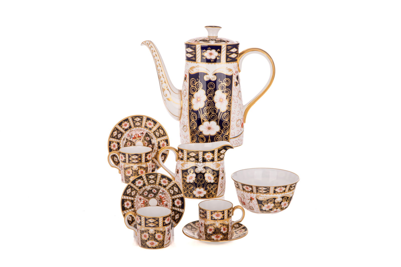 9PC ROYAL CROWN DERBY IMARI 2451 COFFEE SET: Coffee pot, cream jug and sugar bowl, six demi tasse coffee cups & saucers. Coffee pot H. 9" x W. 9 7/8" x D. 3 3/4" (22.9cm x 25.1cm x 9.7cm) Demitasse cup H. 2 1/4" x Dia. 2 3/8" (5.7cm x 6.1cm)