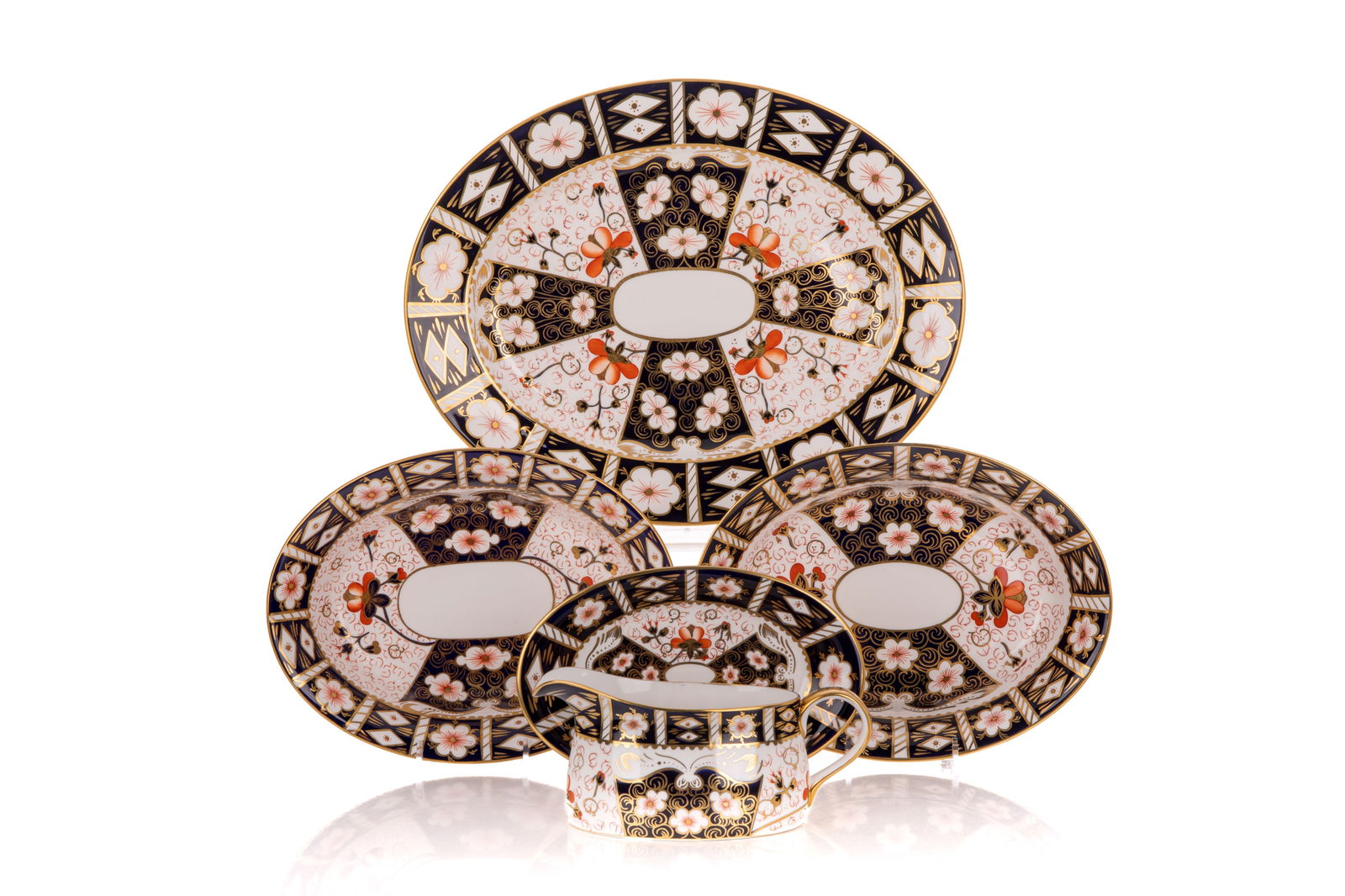 VARIOUS ROYAL CROWN DERBY IMARI 2451 SERVERS: Elliptical-shaped serving bowl and tray; one ovoid serving bowl; and a gravy boat and plate Tray W. 14 15/16" x D. 12" (37.9cm x 30.4cm) Bowl H. 2 1/16" x W. 10 1/4" x D. 7 7/8" (5.1cm x 26cm x 19.9cm