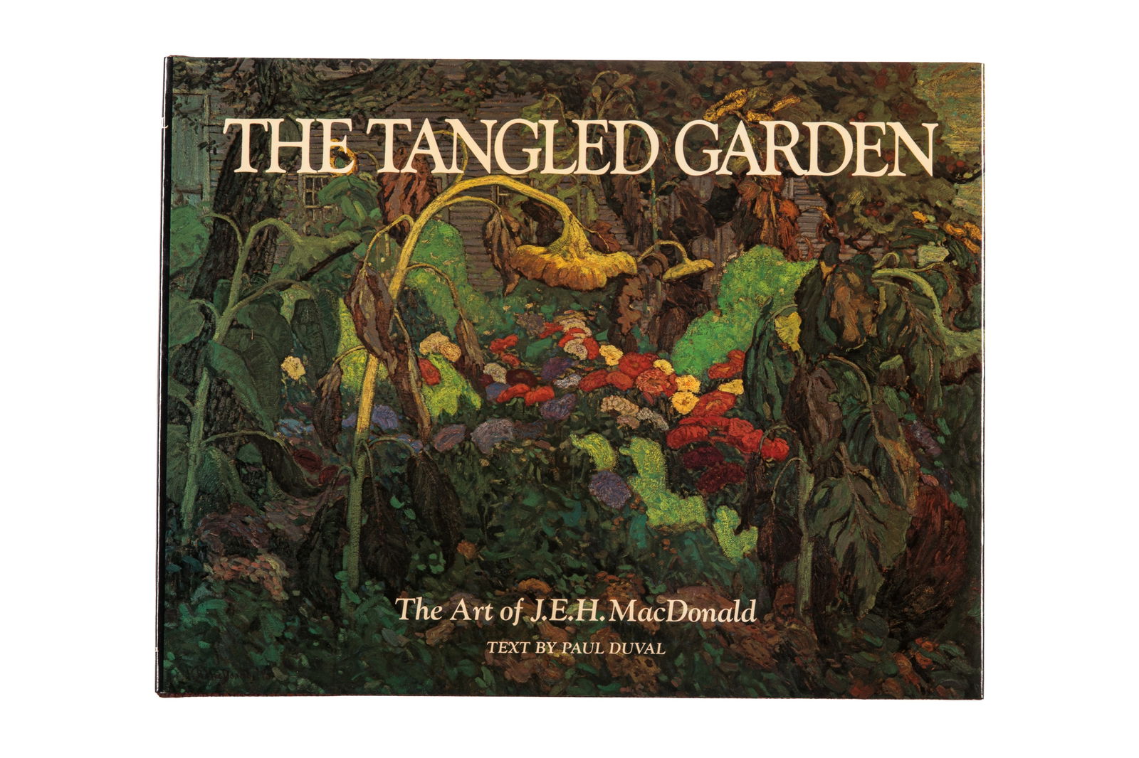 PAUL DUVAL. THE TANGLED GARDEN (SIGNED): Author: Paul Duval Title: The Tangled Garden. The Art of J.E.H. MacDonald Place Published: Scarborough, ON Publisher: Cerebrus Publishing Limited Date Published: 1978 Description: First edition. Hardc