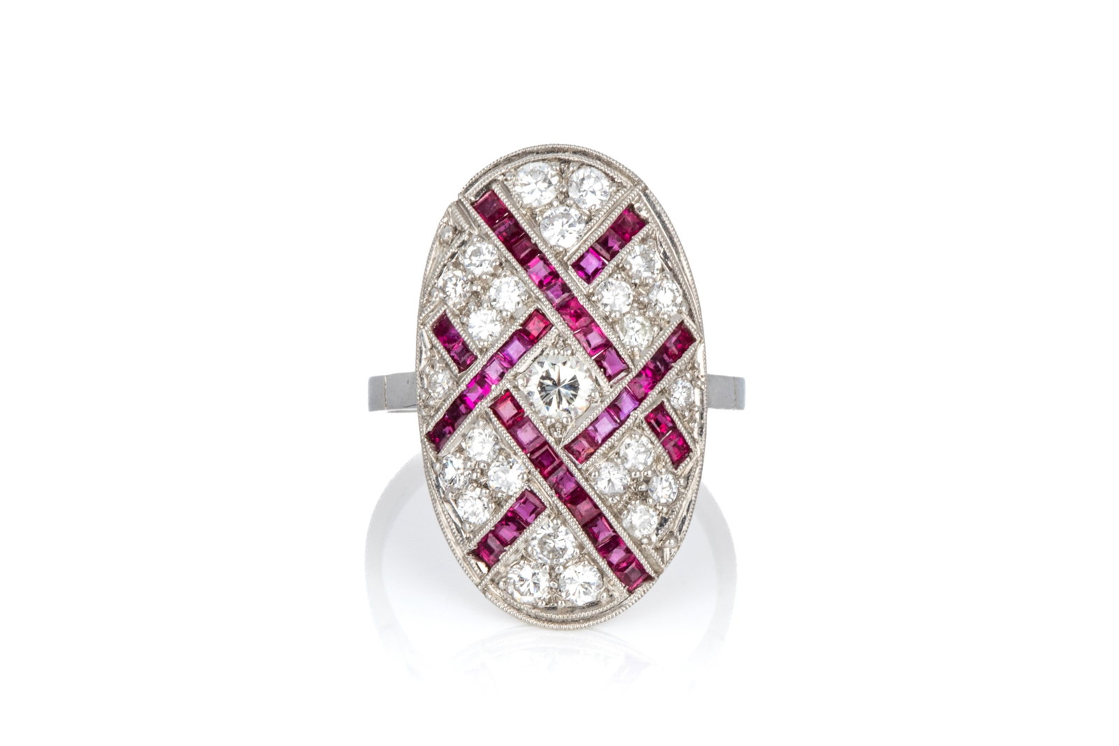 PLATINUM DIAMOND & RUBY ART DECO STYLE RING 5.13g: Platinum Art Deco inspired ring, top measuring 22.7mm long by 13.6mm wide by 4.3mm tall, shoulders measuring 1.8mm wide. Interior of shank equipped with 2 permanent sizing balls to reducespinning duri