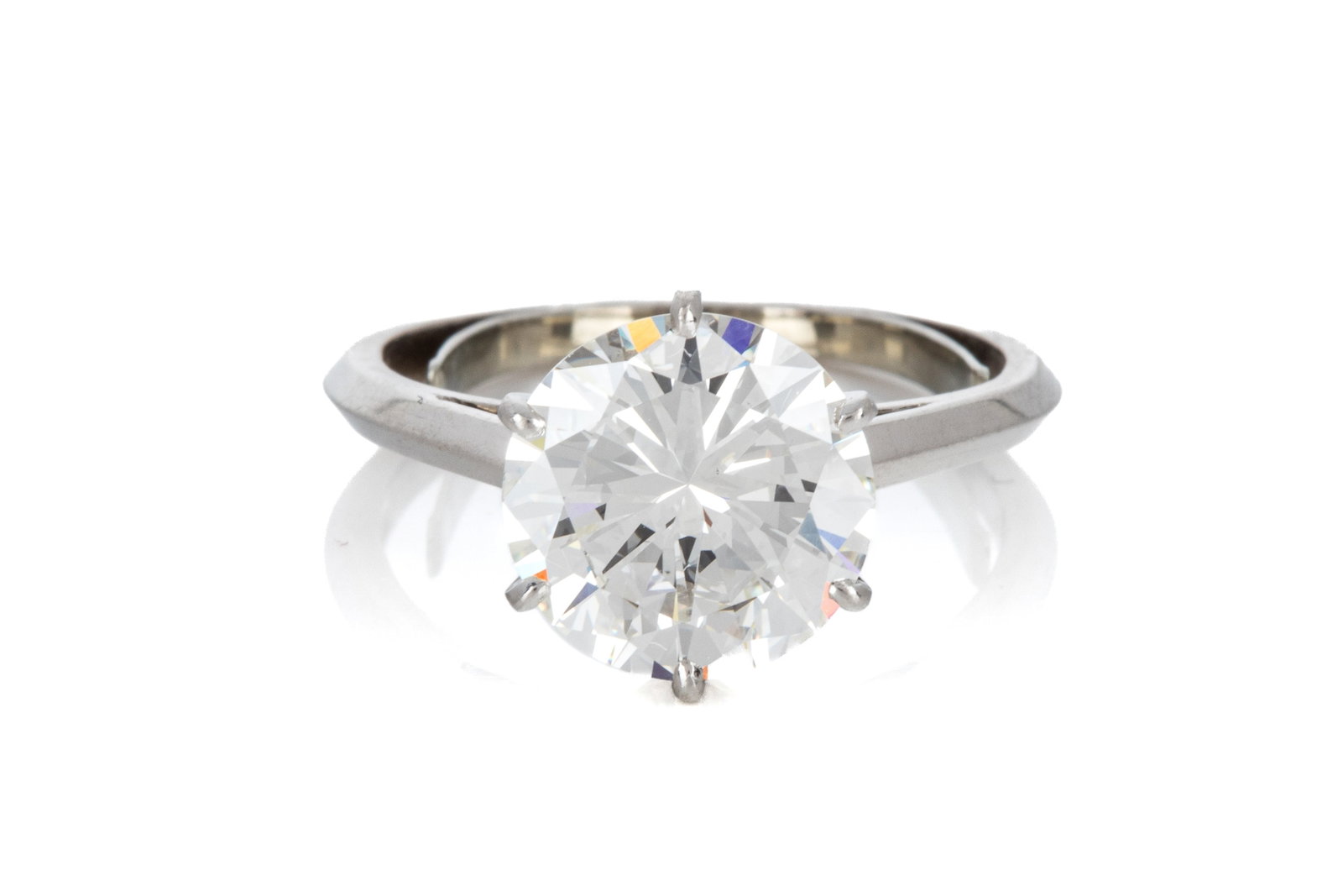 3.32CT VS1-GH PLATINUM SOLITAIRE DIAMOND RING 4.7g: Platinum solitaire engagement ring, knife edge 1.8mm wide shank, cathedral shoulders, 6-prong double gallery setting. 3.32ct (by formula) round brilliant cut diamondmeasuring approximately 9.84 - 9.92