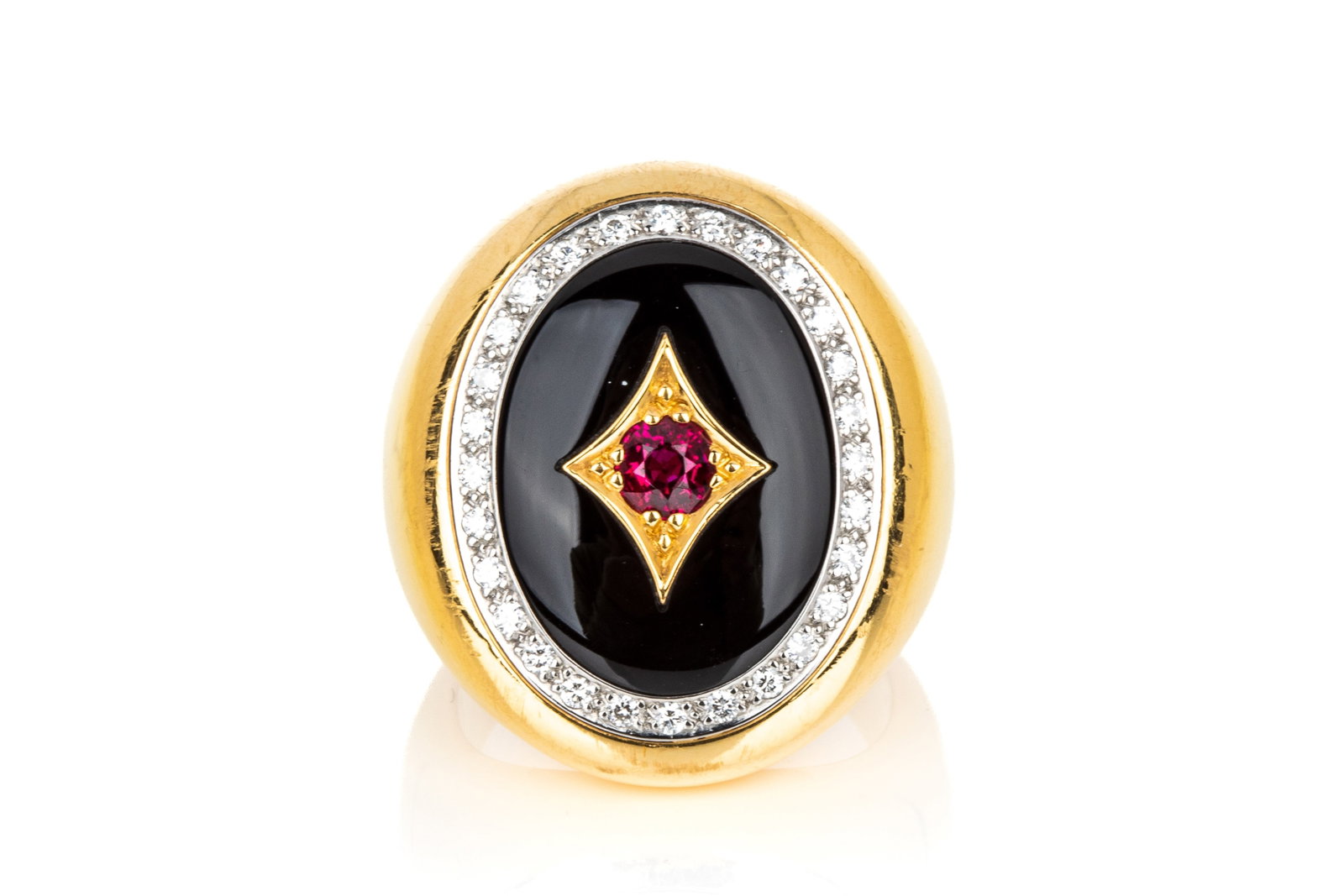 18K ONYX, DIAMOND & RUBY GENTS RING 55.63g: Custom made yellow and white gold ring testing approximately 18K, measuring 27.9mm long by 7.5mm tall. Featuring a custom cut black onyx centered with acushion brilliant cut natural vivid red ruby, ey