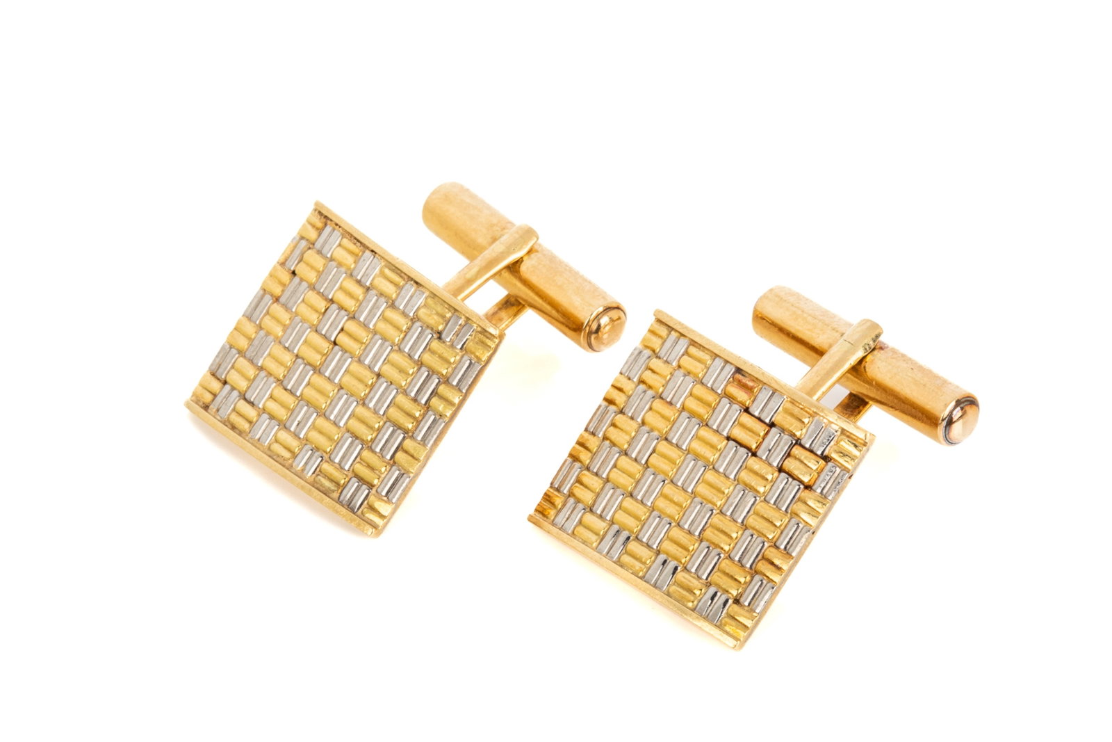 18K ENGLISH-MADE WEAVE PATTERN CUFFLINKS 15.3g: 18K yellow gold and rhodium made in London, England cufflinks, measuring 18.8mm by 16.3mm, equipped with angled bullet-backs. 15.3 grams