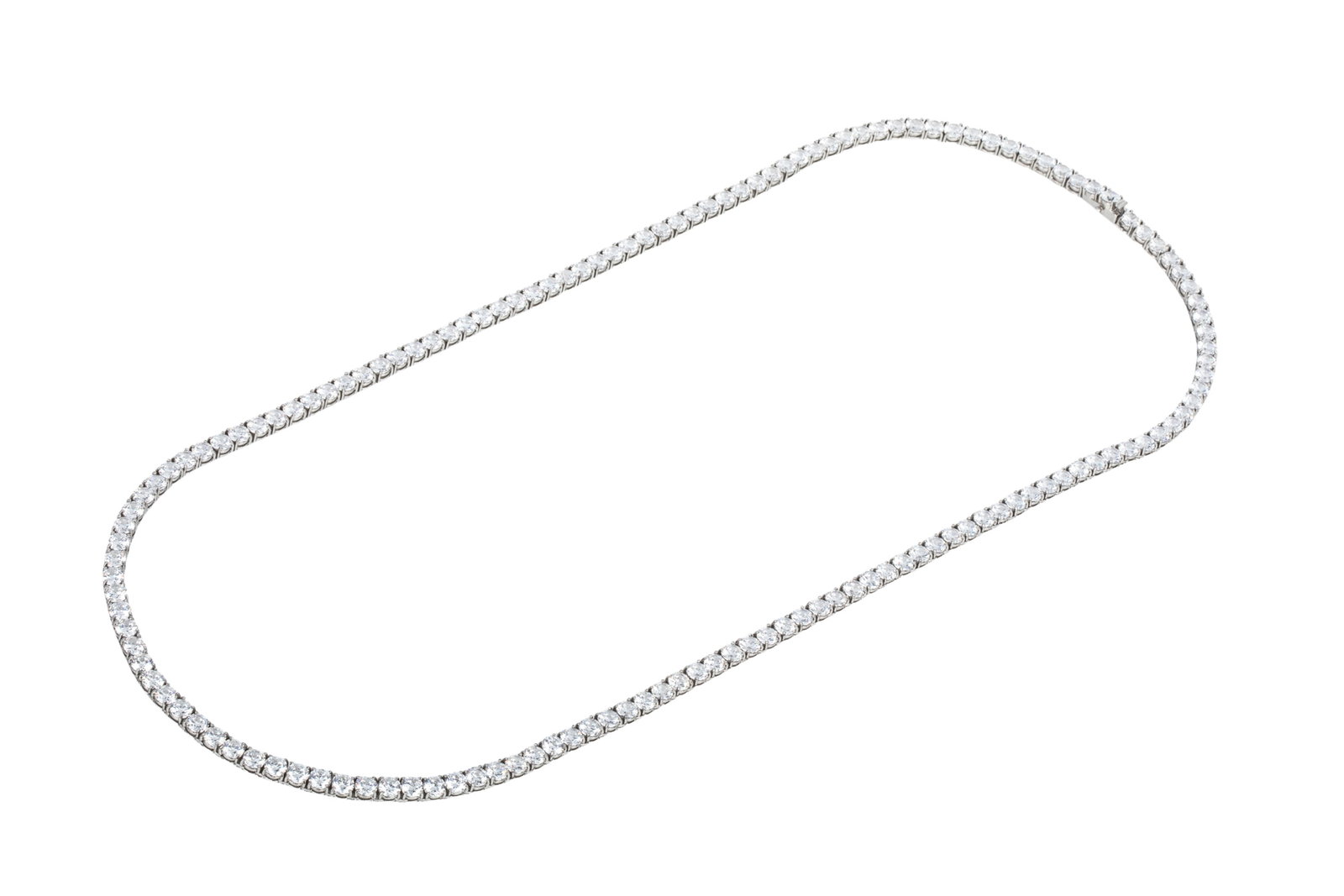 56 INCH CZ STERLING SILVER TENNIS NECKLACE 98.6g: Sterling silver tennis necklace measuring 56 inches long by 5.9 - 6mm wide, equipped with hidden box catch with side safety hardware (side safety catch missing).Featuring 142 round brilliant cut colou