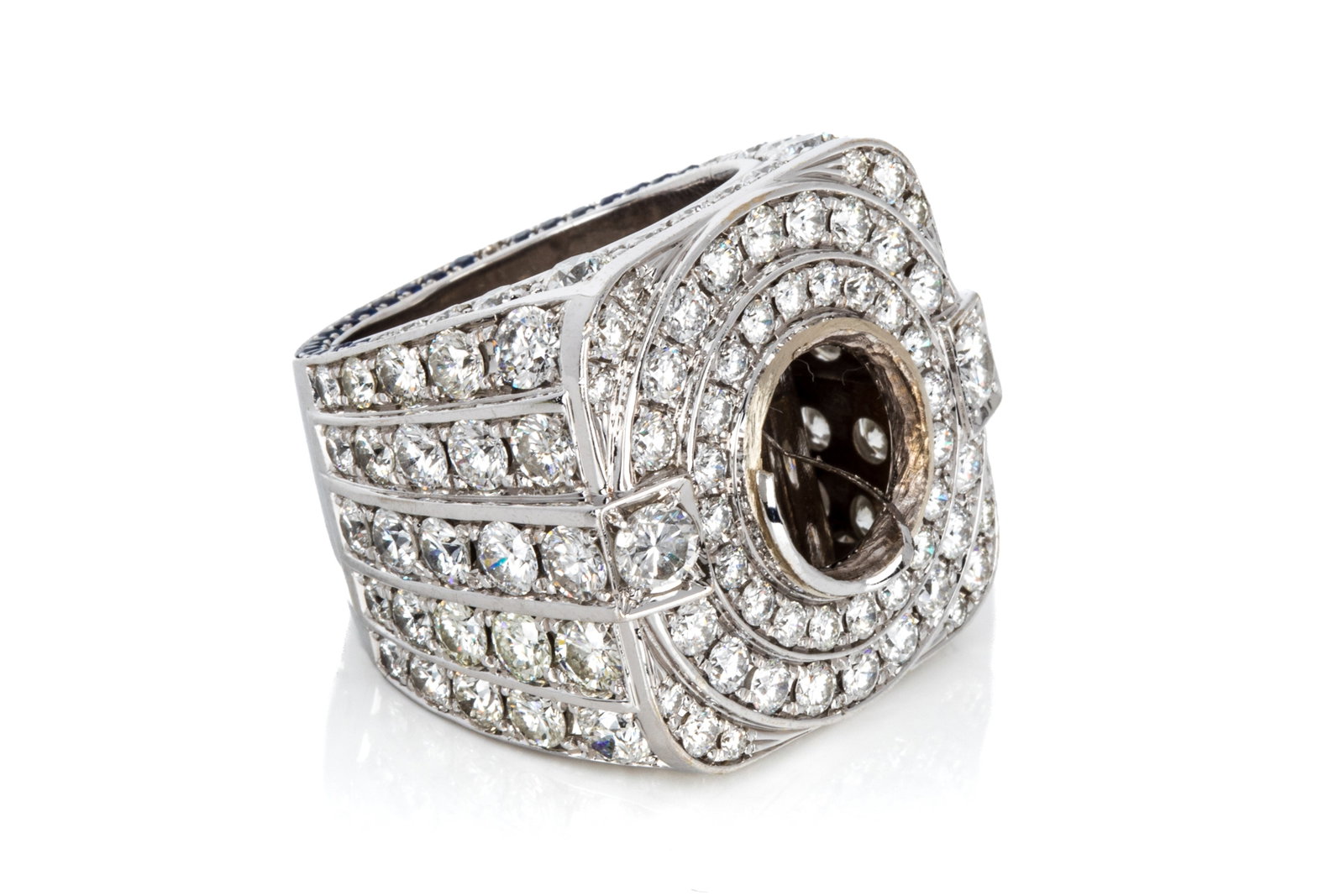 18K DIAMOND SEMI-MOUNT GENTS RING 11.16cttw 60.57g: Custom made 18K white gold diamond and sapphire semi-mount gents ring (main diamond cut out of bezel) measuring 30mm wide by 8.3mm tall, shank bottom measuring 14.2mm wide by 3.2mm thick.Featuring 149