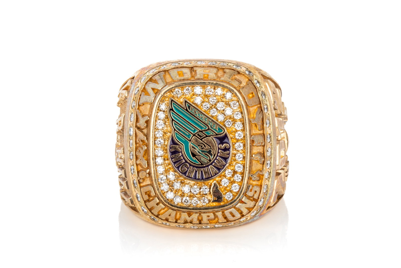 10K GOLD ROCHESTER KNIGHTHAWKS RING 53.4g: 10K yellow gold Rochester Knighthawks lacrosse championship ring, measuring 28.9mm long by 8.9mm tall. Featuring cubic zirconia and black and greenenamel. Size 12 53.4 grams