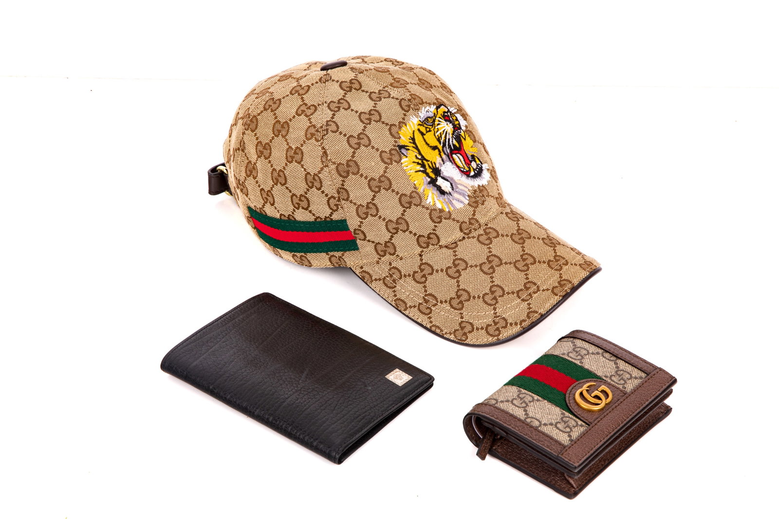 VERSACE AND GUCCI CARD HOLDERS AND GUCCI CAP: Including a Versace Black Leather Travel Passport and Card Holder, and a Gucci GG Ophidia Card Case Wallet, with a monogram "K" to the reverse, and including original dust bag. Both in mintcondition a