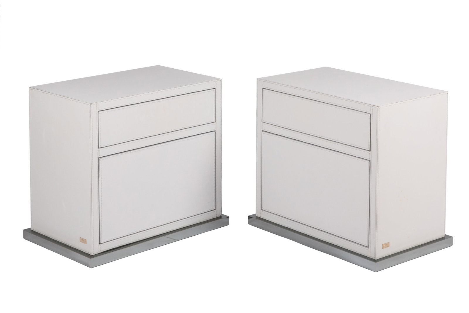 A PAIR OF FORMITALIA LEATHER END TABLES: White leather two drawer end table with exposed stitching, Formitalia, Made in Italy, Model F3333 H. 22" x W. 23 1/2" x D. 14 1/4"