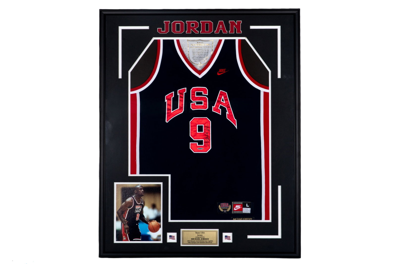 MICHAEL JORDAN FRAMED TEAM USA SIGNED JERSEY: Michael Jordan signed #9 Team USA jersey. Comes with Certificate of Authenticity from Upper Deck. Authentication # BAM06576. Framed measurements: H. 41 1/2" x W. 33 1/2"