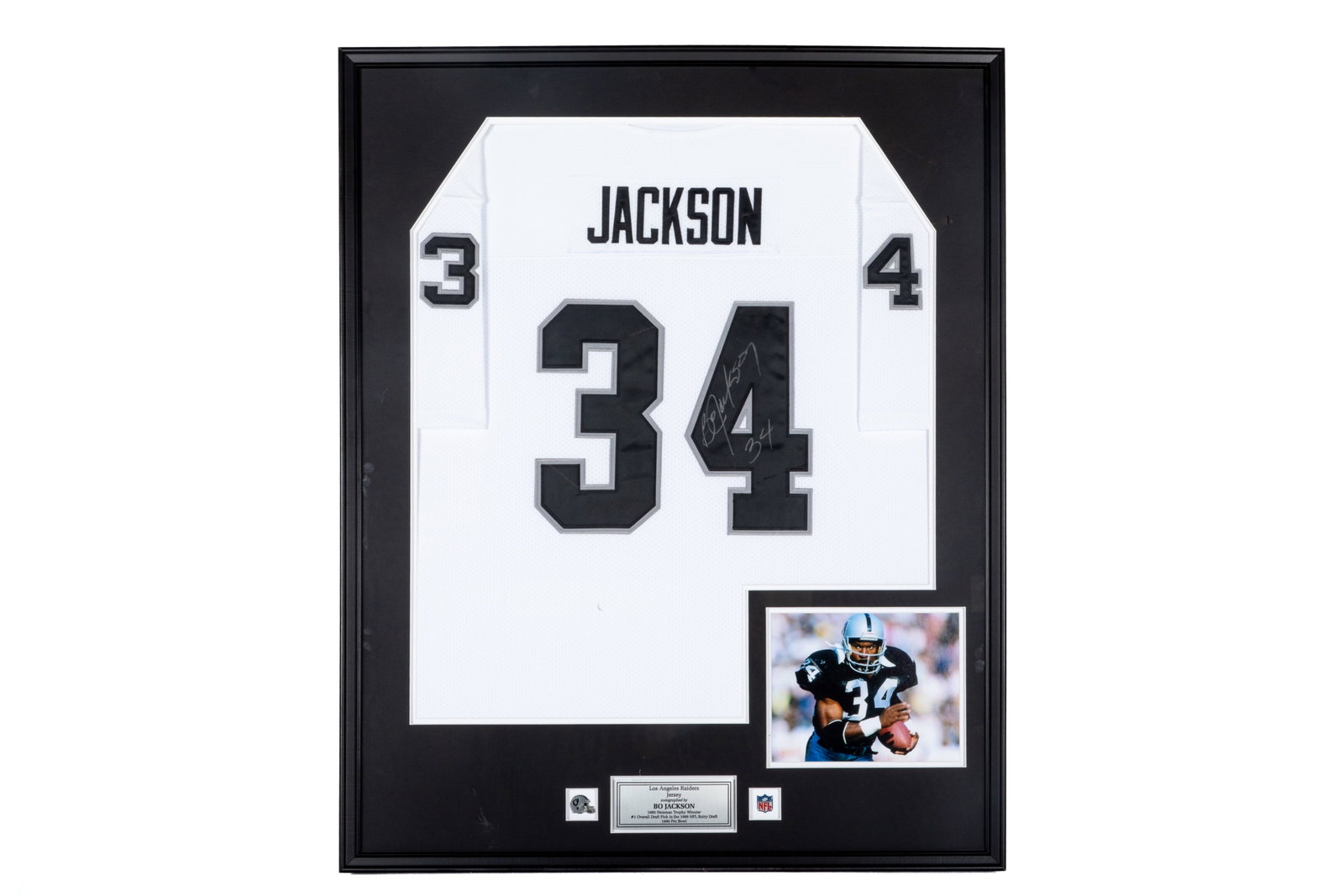 BO JACKSON AUTOGRAPHED FOOTBALL JERSEY: Bo Jackson signed and numbered #34 Los Angeles Raiders jersey. Framed measurements: H. 41 1/2" x W. 33" This lot does not come with a Letter orCertificate of Authenticity.