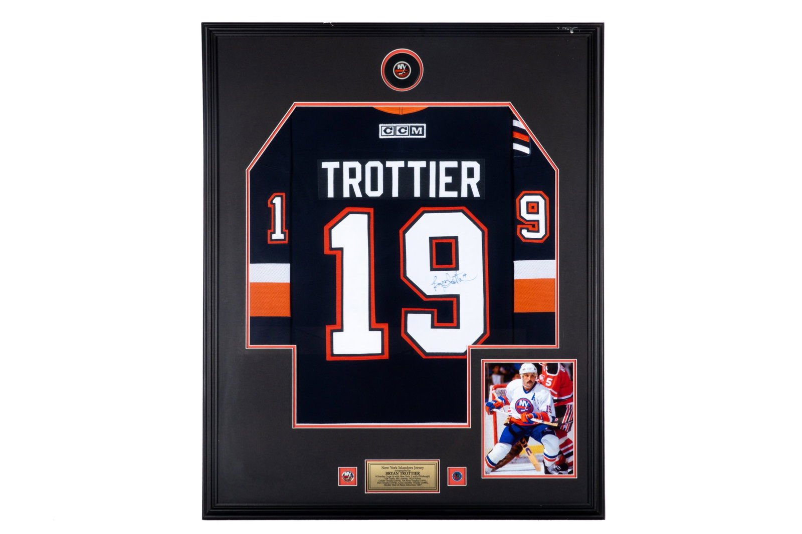 BRYAN TROTTIER FRAMED SIGNED JERSEY: Bryan Trottier signed #19 New York Islanders jersey. Framed measurements: H. 41 1/2 x W. 34 1/2" This lot does not come with a Letter orCertificate of Authenticity.