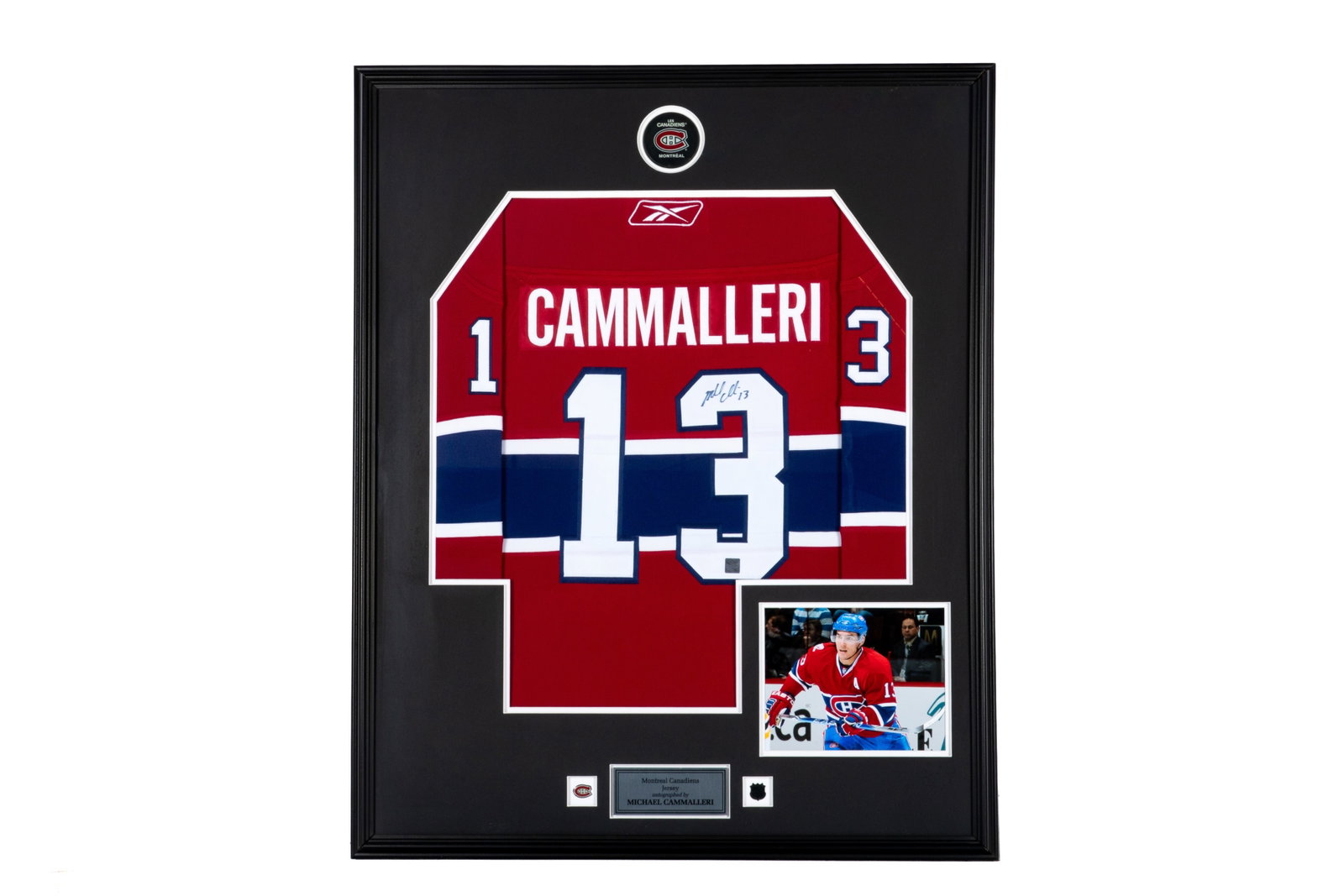 MICHAEL CAMMALLERI SIGNED CANADIENS JERSEY: Michael Cammalleri signed #13 Montreal Canadiens jersey. Framed measurements: H. 42 1/2" x W. 34 1/2" This lot does not come with a Certificate orLetter of Authenticity.