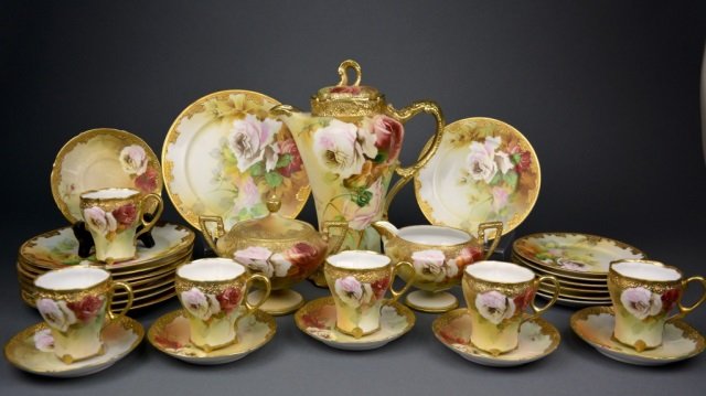 Nippon hand painted porcelain coffee service: - Set comprised of blue maple leaf coffee pot (H: 10 3/4 in.), covered sugar (H: 5 in.) and creamer t/w green maple trios and underplates. Each with floral design and raised gilt decoration. ノ&