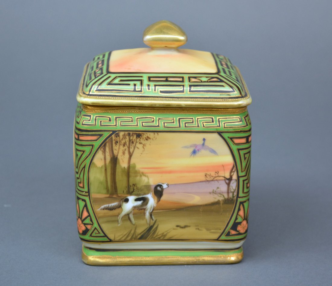 Nippon Porcelain Humidor: With dog and landscape motif and geometric border (minor chip to inside rim). Green M-in-Wreath, H 16.2 cm. (6 3/8 in.) Two very minor chips to inside rim of base