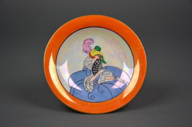 Noritake Art Deco lustre comport: -White pearlized ground with orange lustre border, portrait of a lady in flowing blue dress and feather plum hat. Green M-in-Wreath, Dia 16.5 cm. (6 1/2 in.)