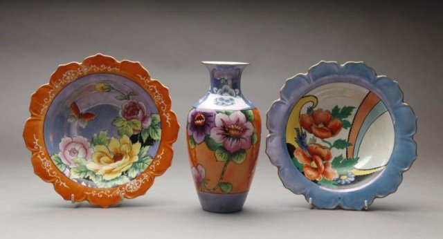Three pieces of Art Deco Noritake: Two flower form bowls and a similar vase all in orange and blue lustre with hand painted flowers. Red Blossom, H of vase 25 cm. (9 7/8 in.) Orange bowl with very minor chip to underside of rim