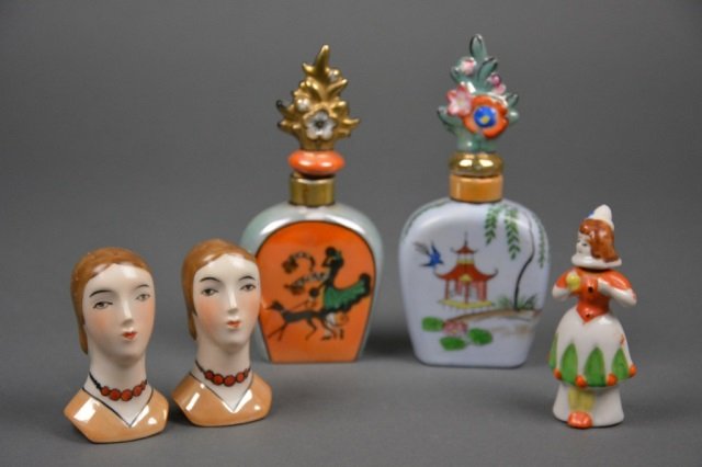 Lot of Art Deco Noritake Scent Bottles & Shakers: - Two figural bottles with floral stoppers (one MIJ), MIJ figural clown scent and pair of bust shakers. H of bottle 14.5 cm. (5 3/4 in.)