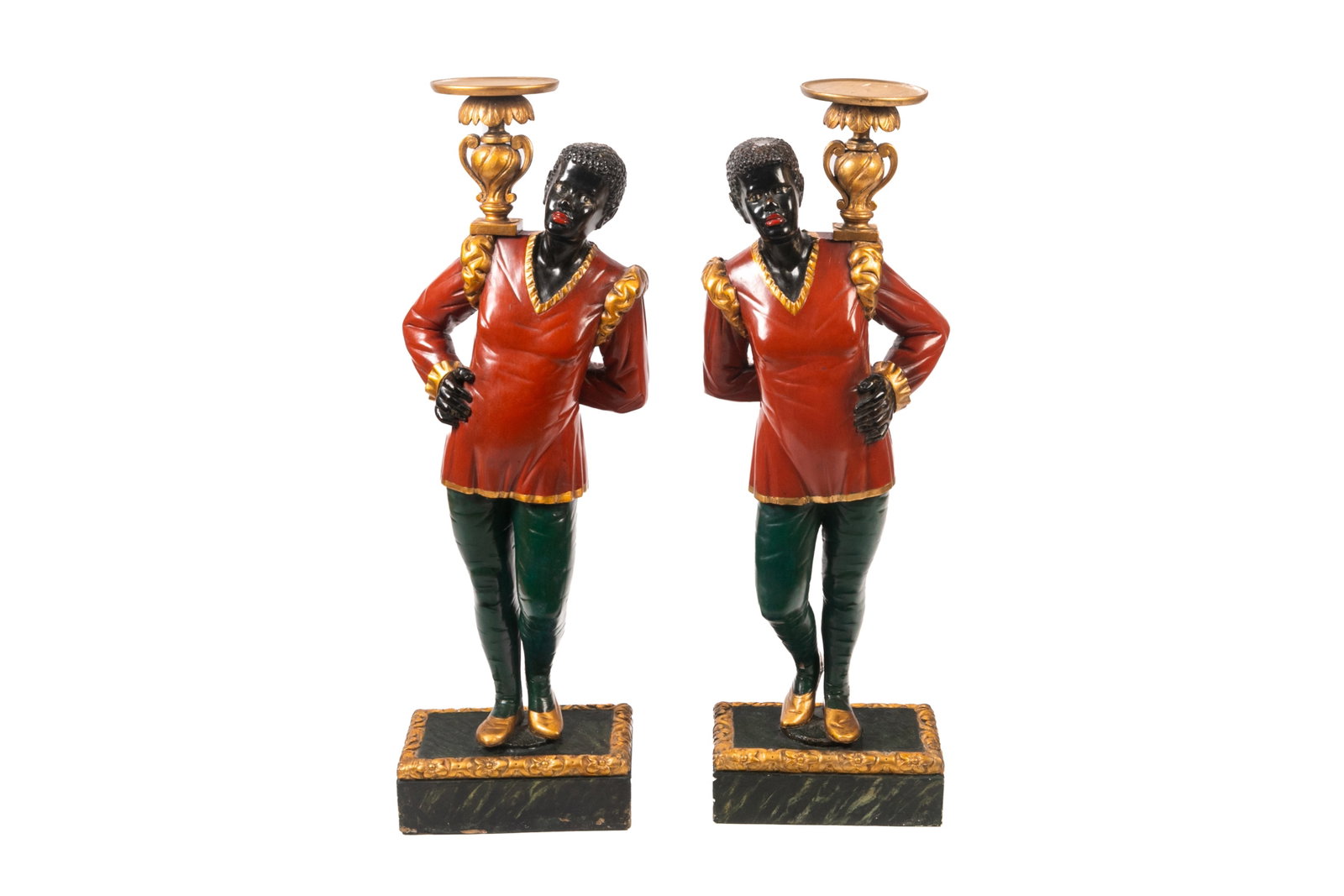 PAIR OF ANTIQUE VENETIAN BLACKAMOOR FIGURES: Carved wood and polychrome painted standing female Blackamoor figures in red and green dress, each holding a giltwood urn. Italian, 18th C. Purchased at Mallets, London. From a Montreal Collection.