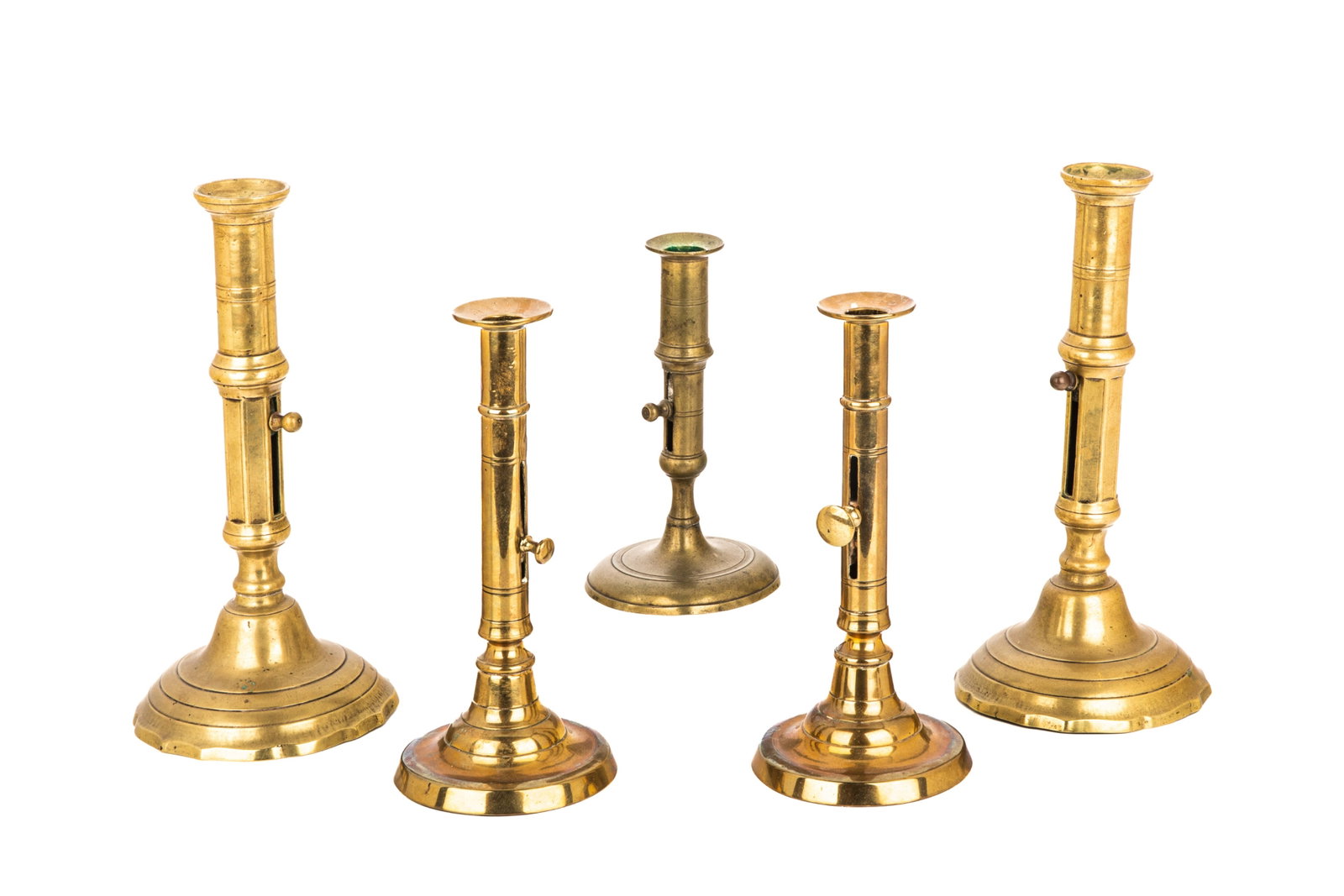 FIVE ANTIQUE BRASS PUSH CANDLESTICKS: Probably Georgian, including two pairs and a single candlestick, English, 18th C. H.10.2in x W. 5.1in (26cm x 13cm)