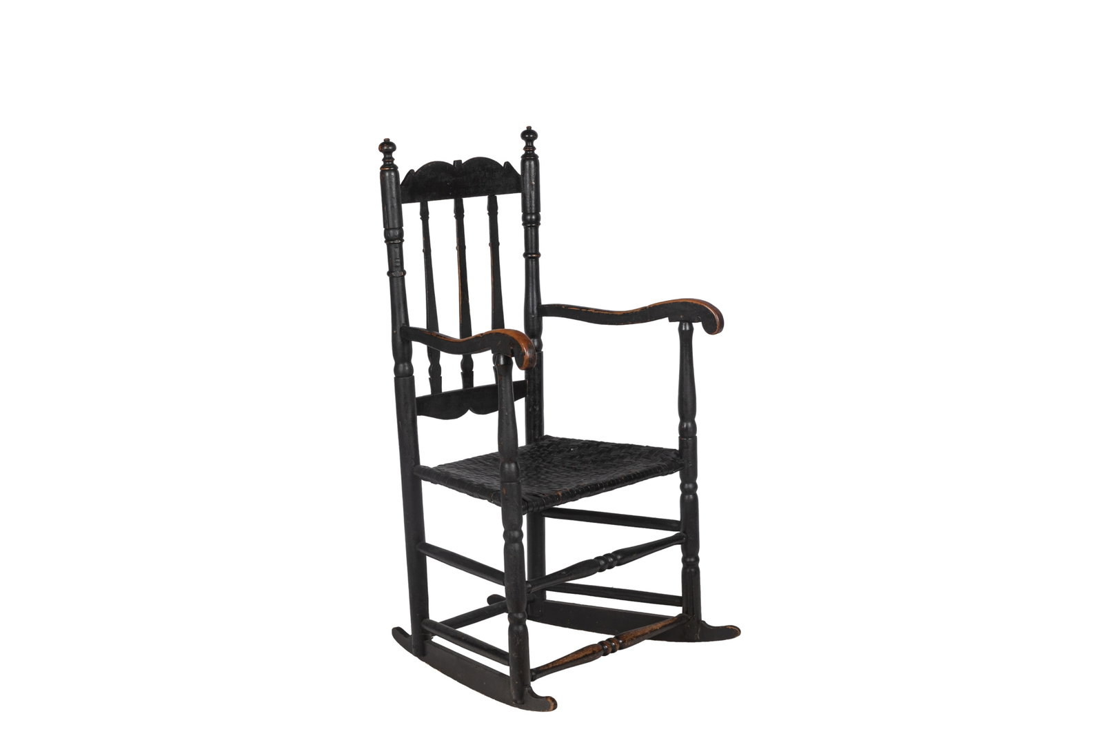 AMERICAN 18th C BANNISTER BACK ARM CHAIR ROCKERS: American 18th century maple bannister back armchair in old black paint. Retaining old or original splint seat. Probably Massachusetts. Late 18th century. H. 45 1/2in x W. 24 1/2in x D. 21in