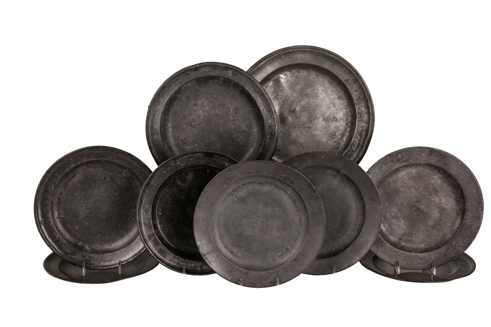 NINE 18th C PEWTER PLATES: Includes 2 18th century pewter plates with 'London' marked on the bottom (the rest of the markings are faded). Includes 1 similar pewter plate with no visible markings. Also includes 2 early 18th cent