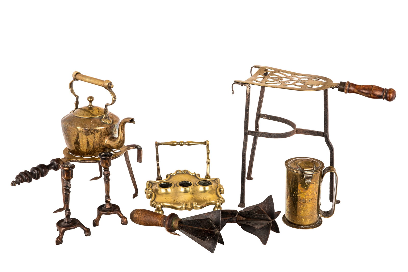 GROUP OF ANTIQUE BRASS: Including a pair of early tripod candlesticks, two trivets with wrought iron legs, a inkstand, hollowares and two primitive food choppers. H. of candlesticks 6.7in x W. 3.5in (17cm x 9cm)